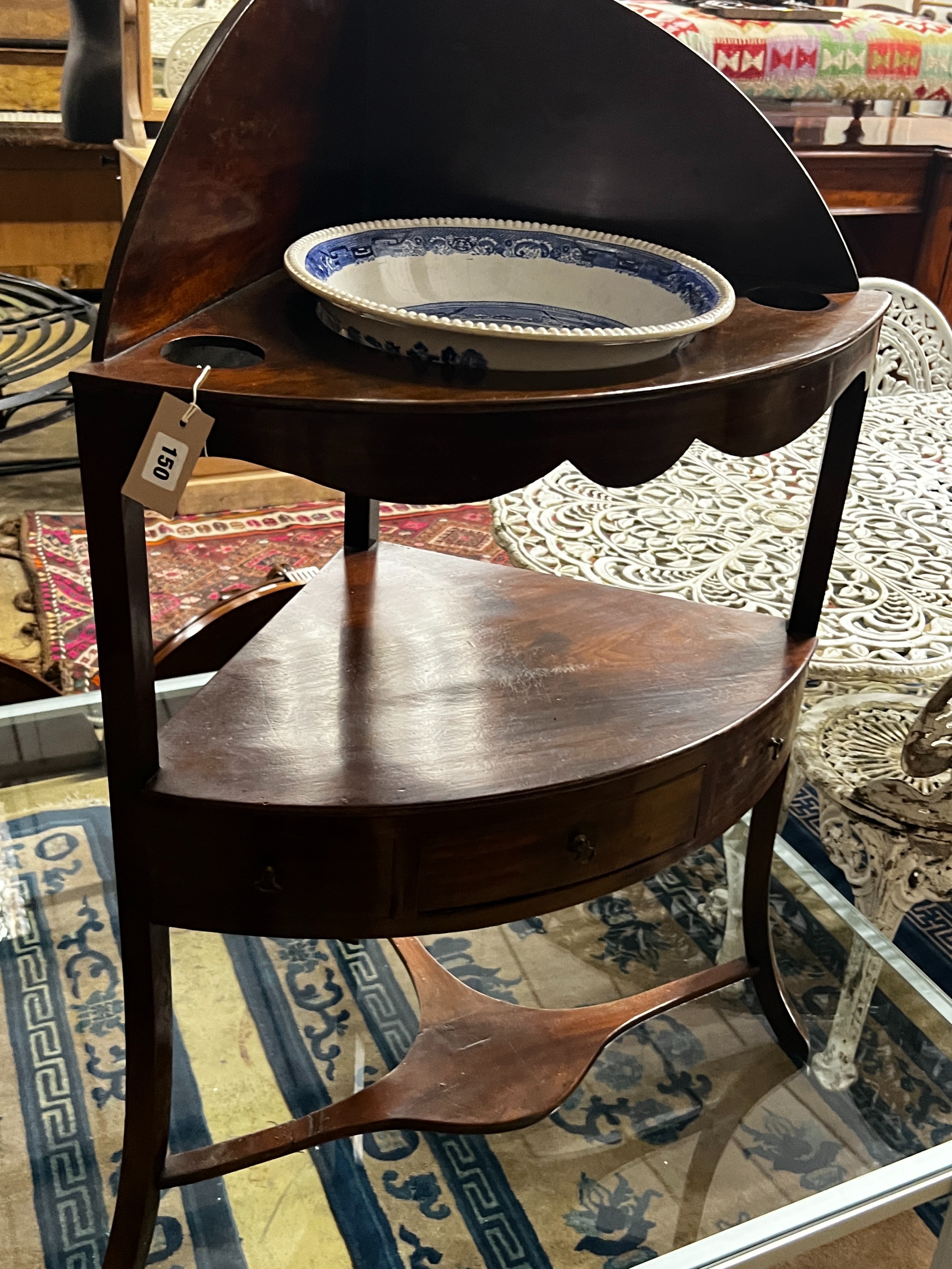 A George III mahogany bowfront corner washstand